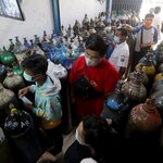 Indonesians lining up at an oxygen refill shop in Jakarta on Wednesday as Covid-19 cases rose.